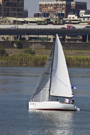 TAIPEI,TAIWAN -November 10,2012:Keel Boat Sailing on river in 2012 Taipei Keel Boat Competition in Dadaocheng Wharf on November 10,2012 in Taipei,Taiwanのeditorial素材