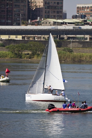 TAIPEI,TAIWAN -November 10,2012:Keel Boat Sailing on river in 2012 Taipei Keel Boat Competition in Dadaocheng Wharf on November 10,2012 in Taipei,Taiwanのeditorial素材