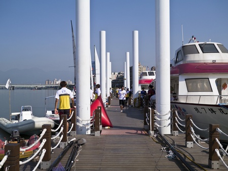 TAIPEI,TAIWAN -November 10,2012:Boat on dock with players in 2012 Taipei Keel Boat Competition in Dadaocheng Wharf on November 10,2012 in Taipei,Taiwanのeditorial素材