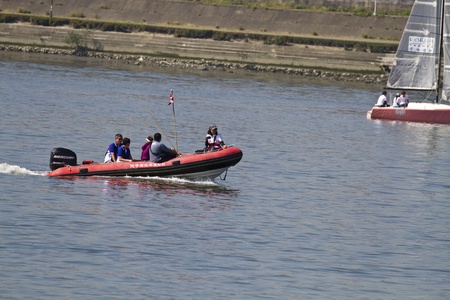 TAIPEI,TAIWAN -November 10,2012:Boat Sailing on river with staff members in 2012 Taipei Keel Boat Competition in Dadaocheng Wharf on November 10,2012 in Taipei,Taiwanのeditorial素材