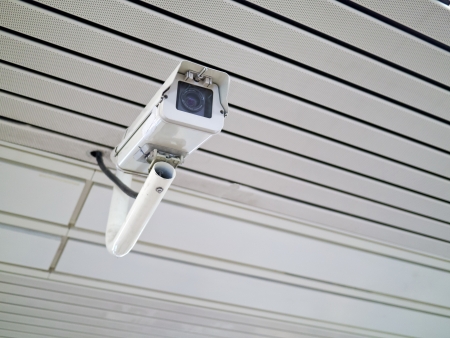 security camera on wall in public space indoorの写真素材