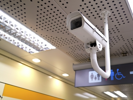 security camera on wall in public space indoor