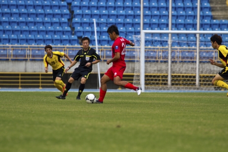 TAIPEI,TAIWAN -November 14,2012:football players in the All-Taiwan Intercity Football Competition in Taipei stadium on November 14,2012 in Taipei,Taiwanのeditorial素材