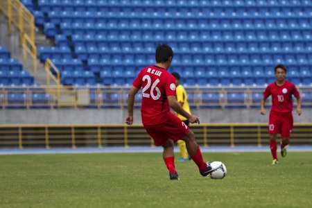 TAIPEI,TAIWAN -November 14,2012:football players in the All-Taiwan Intercity Football Competition in Taipei stadium on November 14,2012 in Taipei,Taiwanのeditorial素材