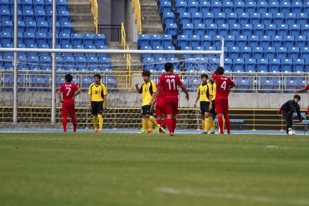 TAIPEI,TAIWAN -November 14,2012:football players in the All-Taiwan Intercity Football Competition in Taipei stadium on November 14,2012 in Taipei,Taiwanのeditorial素材