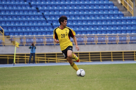 TAIPEI,TAIWAN -November 14,2012:football player in the All-Taiwan Intercity Football Competition in Taipei stadium on November 14,2012 in Taipei,Taiwanのeditorial素材