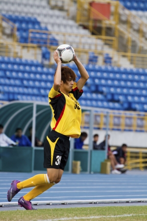 TAIPEI,TAIWAN -November 14,2012:football player in the All-Taiwan Intercity Football Competition in Taipei stadium on November 14,2012 in Taipei,Taiwanのeditorial素材