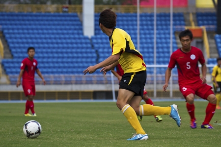 TAIPEI,TAIWAN -November 14,2012:football players in the All-Taiwan Intercity Football Competition in Taipei stadium on November 14,2012 in Taipei,Taiwanのeditorial素材