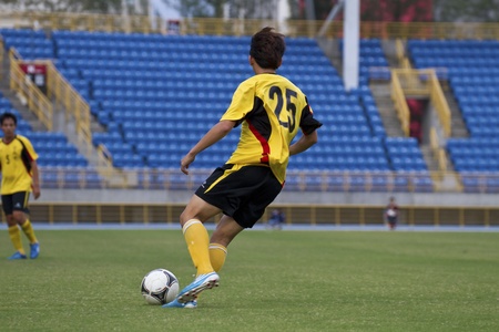 TAIPEI,TAIWAN -November 14,2012:football players in the All-Taiwan Intercity Football Competition in Taipei stadium on November 14,2012 in Taipei,Taiwanのeditorial素材