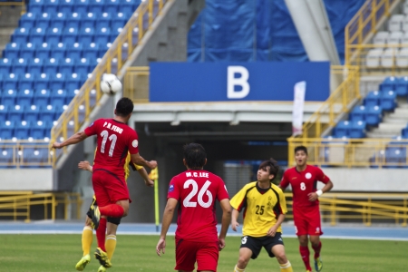 TAIPEI,TAIWAN -November 14,2012:football players in the All-Taiwan Intercity Football Competition in Taipei stadium on November 14,2012 in Taipei,Taiwanのeditorial素材