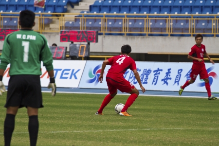 TAIPEI,TAIWAN -November 14,2012:football players in the All-Taiwan Intercity Football Competition in Taipei stadium on November 14,2012 in Taipei,Taiwanのeditorial素材