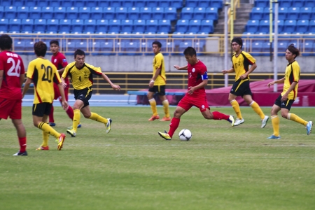TAIPEI,TAIWAN -November 14,2012:football players in the All-Taiwan Intercity Football Competition in Taipei stadium on November 14,2012 in Taipei,Taiwanのeditorial素材