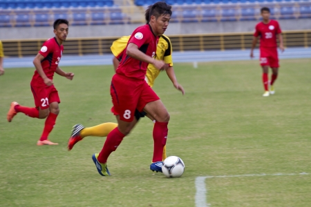 TAIPEI,TAIWAN -November 14,2012:football players in the All-Taiwan Intercity Football Competition in Taipei stadium on November 14,2012 in Taipei,Taiwanのeditorial素材