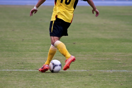 TAIPEI,TAIWAN -November 14,2012:football player in the All-Taiwan Intercity Football Competition in Taipei stadium on November 14,2012 in Taipei,Taiwanのeditorial素材