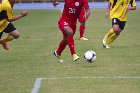 TAIPEI,TAIWAN -November 14,2012:football players in the All-Taiwan Intercity Football Competition in Taipei stadium on November 14,2012 in Taipei,Taiwanのeditorial素材
