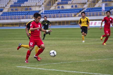 TAIPEI,TAIWAN -November 14,2012:football players in the All-Taiwan Intercity Football Competition in Taipei stadium on November 14,2012 in Taipei,Taiwanのeditorial素材