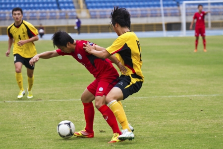 TAIPEI,TAIWAN -November 14,2012:football players in the All-Taiwan Intercity Football Competition in Taipei stadium on November 14,2012 in Taipei,Taiwanのeditorial素材