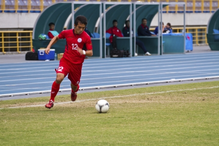 TAIPEI,TAIWAN -November 14,2012:football player in the All-Taiwan Intercity Football Competition in Taipei stadium on November 14,2012 in Taipei,Taiwanのeditorial素材
