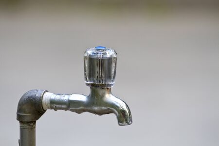 faucet with clear bokehの写真素材