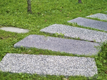 bricks footpath on grassland in parkの写真素材