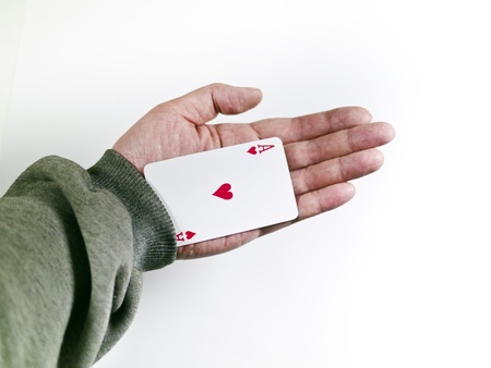 Poker player cheats with card from the sleeve  Challenge to the casinoの写真素材