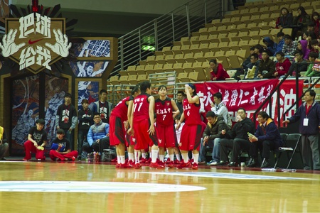New Taipei City - March 03: players participates in an HBL champion basketball game at the XinZhuang Sports  Centre on March 03, 2013 in New Taipei City, Taiwan. The YunJen high school beat the HuJian school.のeditorial素材