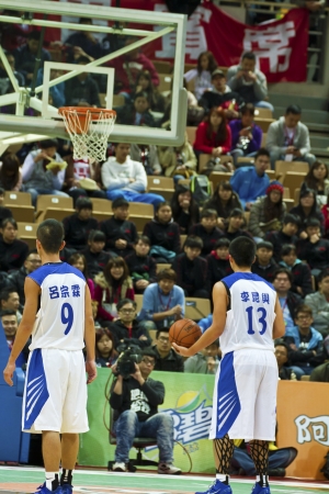 New Taipei City - March 03: player Lee participates in an HBL champion basketball game at the XinZhuang Sports  Centre on March 03, 2013 in New Taipei City, Taiwan. The NengRen high school beat the ShinRong high school.のeditorial素材