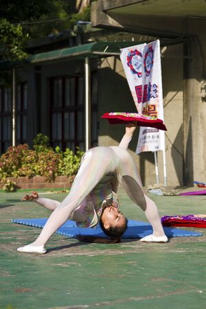 New Taipei City, Taiwan - OCT 17, 2015: circus player performing in 435 Art Zone in Banqiao District.のeditorial素材