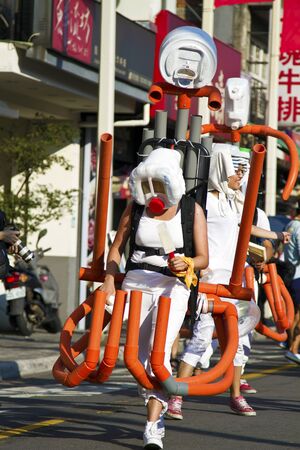 New Taipei City, Taiwan - OCT 03, 2015: Carnival Dancers in the Tamsui Environmental Arts Festival Paradeのeditorial素材