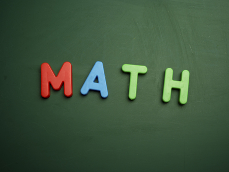 math concept in colorful letters isolated on blank blackboardの写真素材