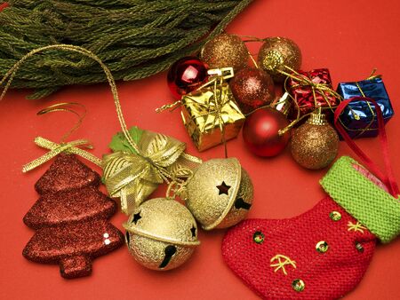 christmas card conception with diversity decorations on red backgroundの写真素材
