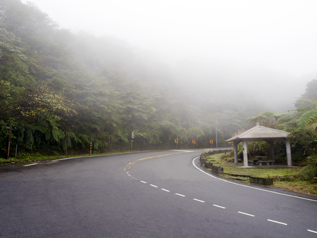 Road in national yangming mountain park in fog weather,Taipei,Taiwanの写真素材