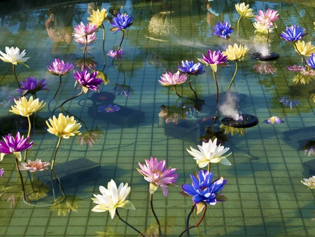 plastic colorful decoration lotus in pond in Shilin Official Residence,Taipei,Taiwanの写真素材