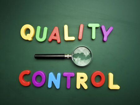 Quality Control text concept on green blackborad backgroundの写真素材