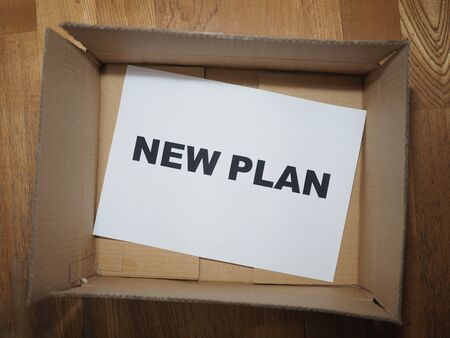text new plan on white paper in open paper boxの写真素材