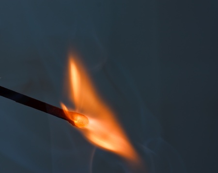 wooden matchstick igniting