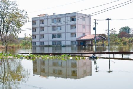 Bangkok, Thailand - November 16: The house is flooded canal at November 16, 2011 at Pathum Thani. Bangkok, which is the worst flood in the history of Thailand.のeditorial素材