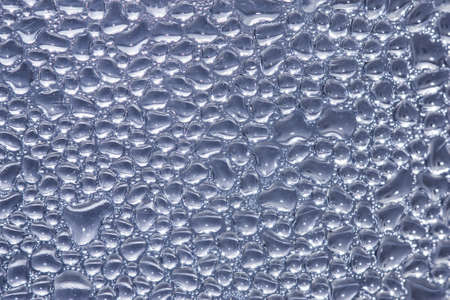Water droplets on the glass surface.