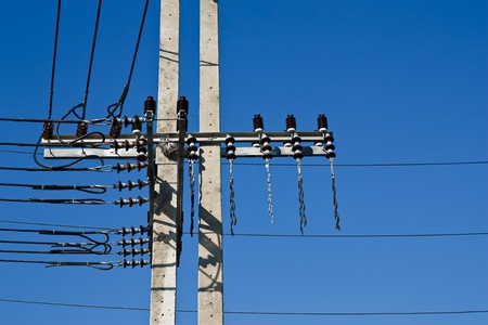 electricity post with blue sky
