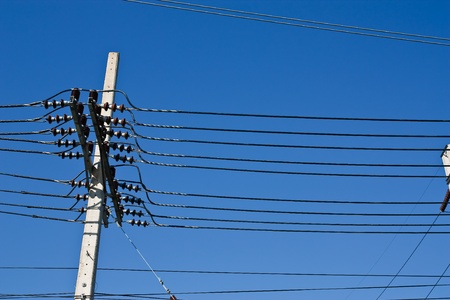 electricity post with blue sky