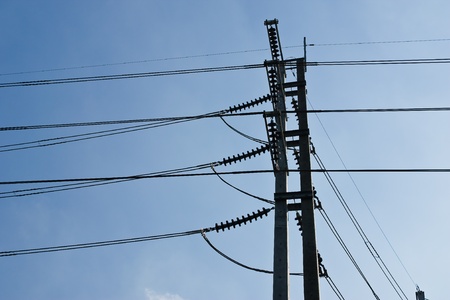 electricity post with blue sky