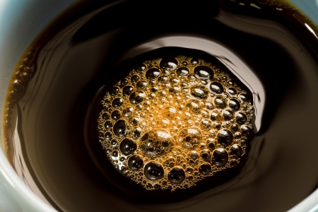 Bubbles in a cup of coffee.の写真素材