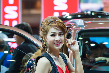 BANGKOK - MARCH 30   Unidentified models present with Isuzu car at The 35th Bangkok International Motor Show 2014 on March 30, 2014 in Bangkok, Thailand のeditorial素材