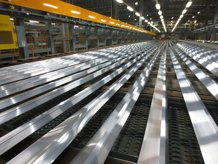 Aluminum lines on a conveyor belt in a factory.のeditorial素材