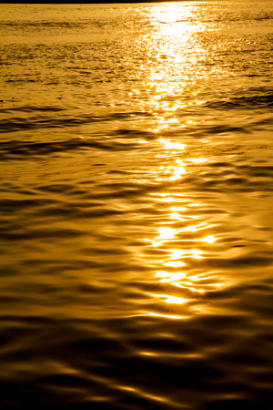 Sun reflected in waterの写真素材