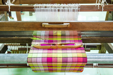 Loom for weaving silk in Thailand.