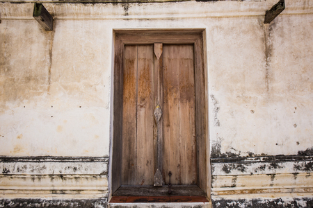 Wooden door frame in a antique sanctuary. Wat Putthaisawan, Ayutthaya Thailand.の写真素材