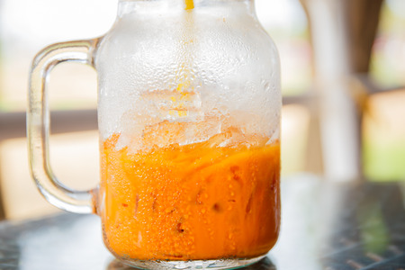 ice tea with milk in glassの写真素材