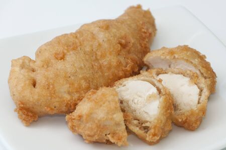 fried chicken in golden crispy batterの写真素材