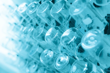 Rows of beaker on a drying rack in a chemistry lab の写真素材